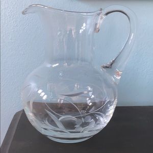 Glass pitcher with etched flowers and vines
